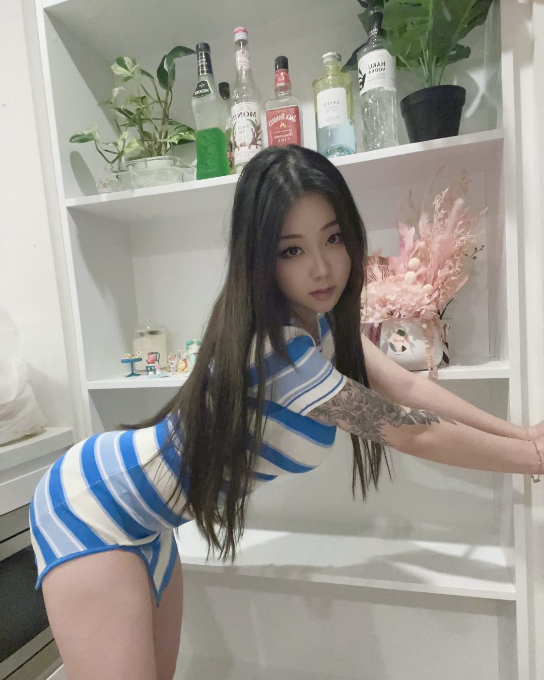 Victoria Kim (Hanavocado) wearing a tight dress while sticking her beautiful ass out in a delicious way